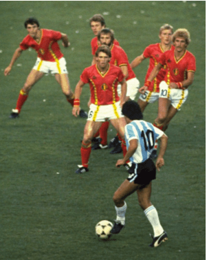 A famous picture of Maradona at the 1982 world cup with 6 Belgium players about to confront him